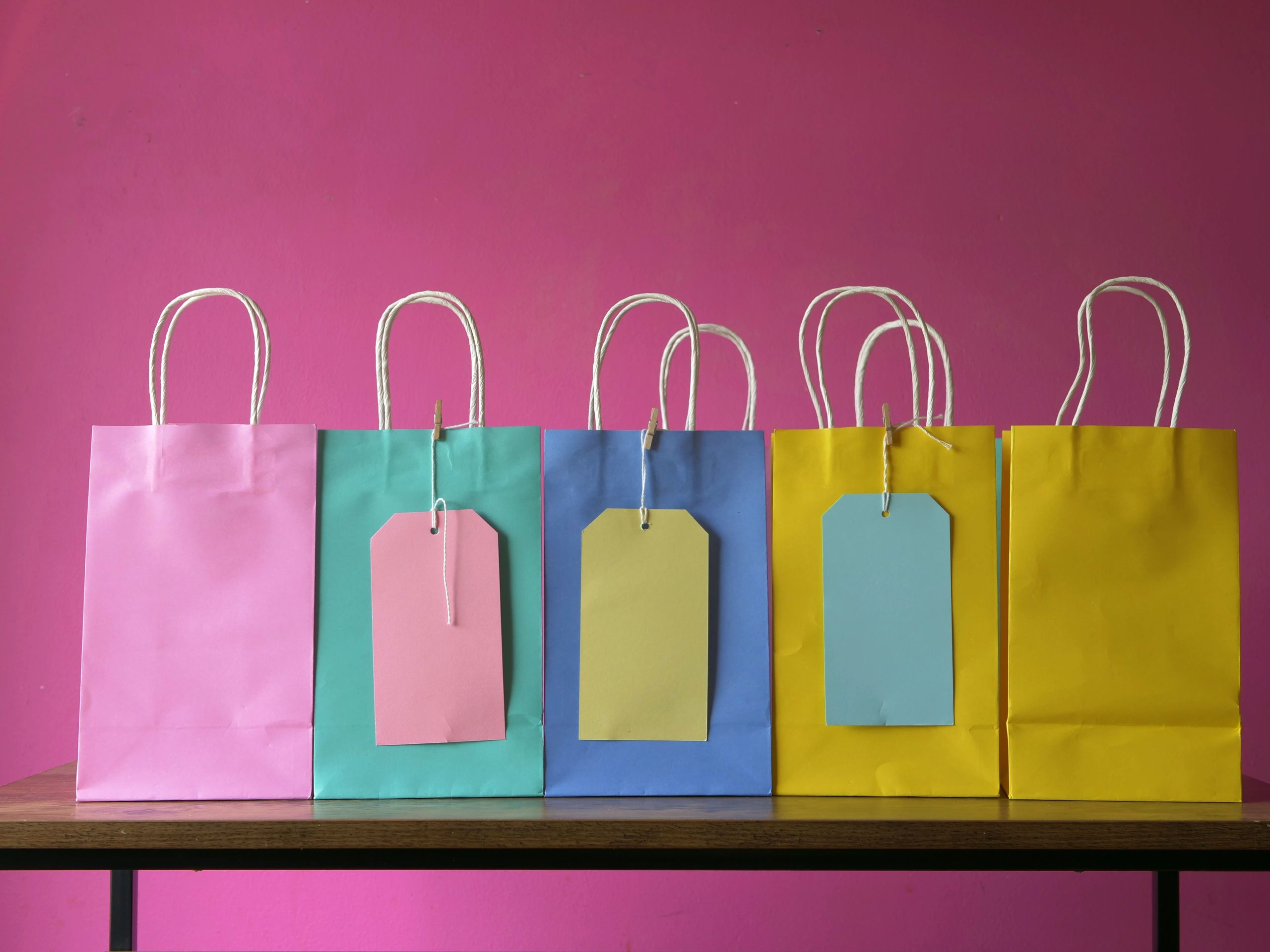 Event-style gift bags lined up for branded packaging use