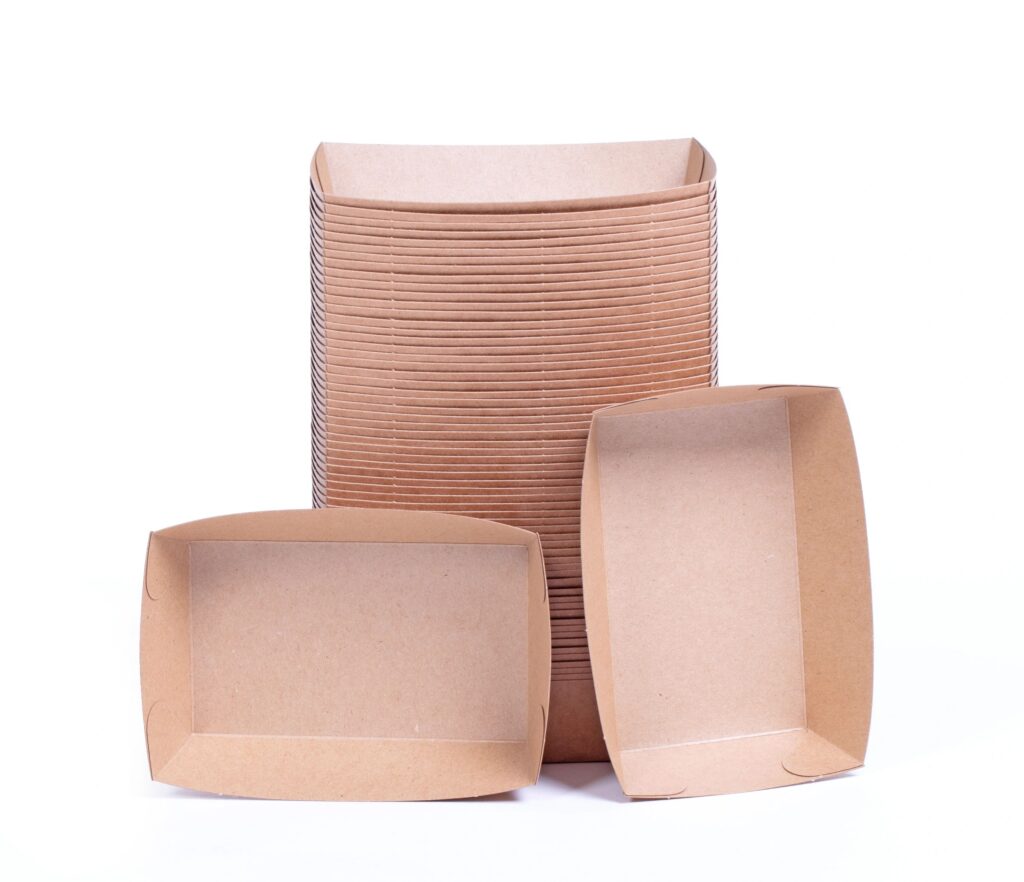 Recycled paper trays for snacks, isolated on white