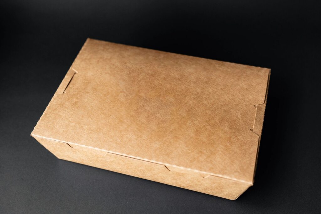 Kraft paper food box on black background – eco-friendly packaging mockup